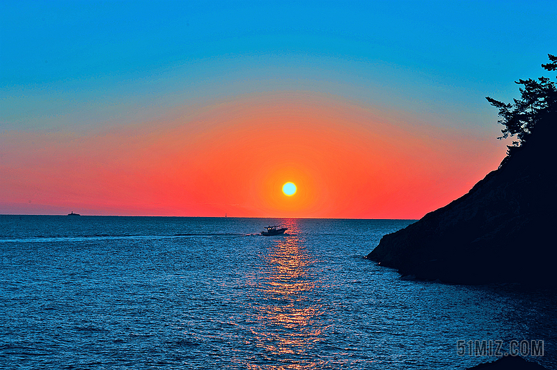 蓝色唯美海边日出日落背景图片